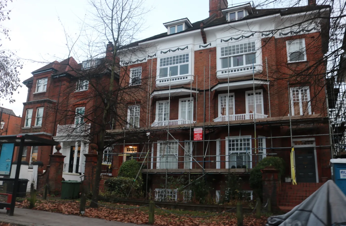 Houses under scaffolding on Belsize Avenue, Belsize Park